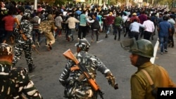 The vote in parliament came as angry protests against the bill intensified in India's northeastern regions bordering Bangladesh, with police clashing with demonstrators in Assam state.