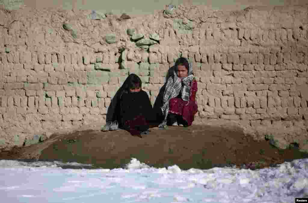 Afghan girls wait for treatment at the Mobile Clinic, provided by Afghan Family Guidance Association, on the outskirts of Kabul. (Reuters/Mohammad Ismail)