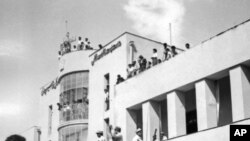 A royalist tank moves into the courtyard of Tehran Radio a few minutes after pro-shah troops occupied the place during the ouster of Prime Minister Mohammad Mossadegh and his government, August 19, 1953