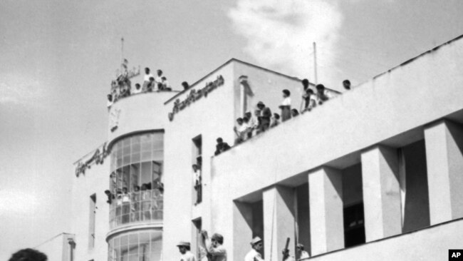 A royalist tank moves into the courtyard of Tehran Radio a few minutes after pro-shah troops occupied the place during the ouster of Prime Minister Mohammad Mossadegh and his government, August 19, 1953