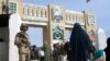 A Pakistani soldier keeps guard at the Friendship Gate, which marks the Afghan border crossing at the Pakistani town of Chaman.