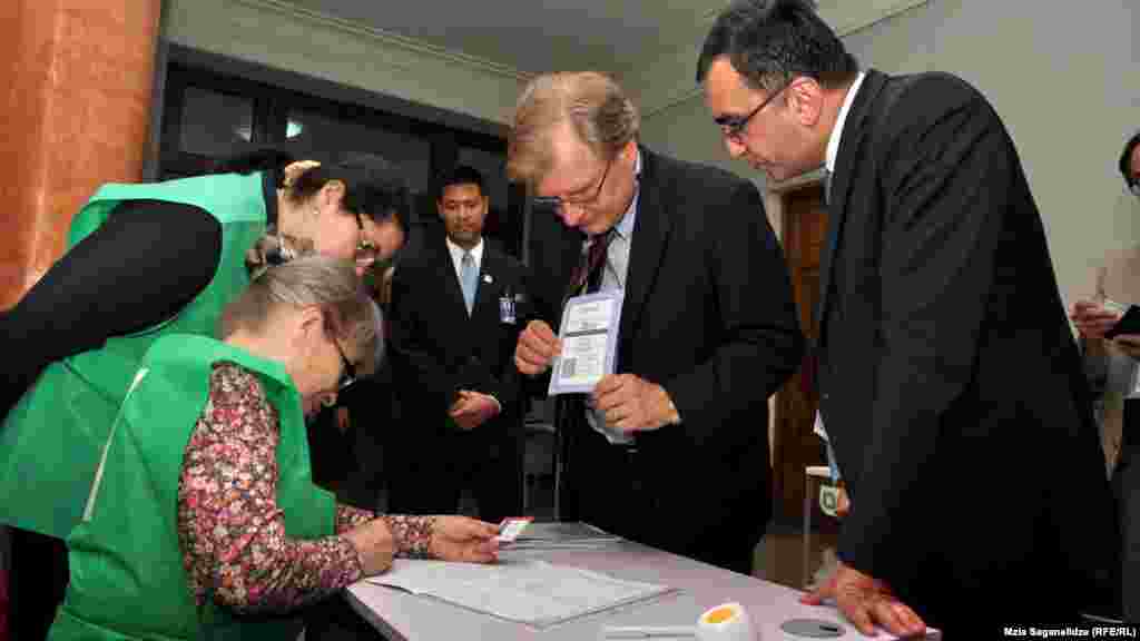 U.S. Ambassador to Georgia Richard Norland watches the voting.