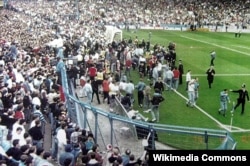 Fans spill out of the Leppings Lane end at Hillsborough in 1989