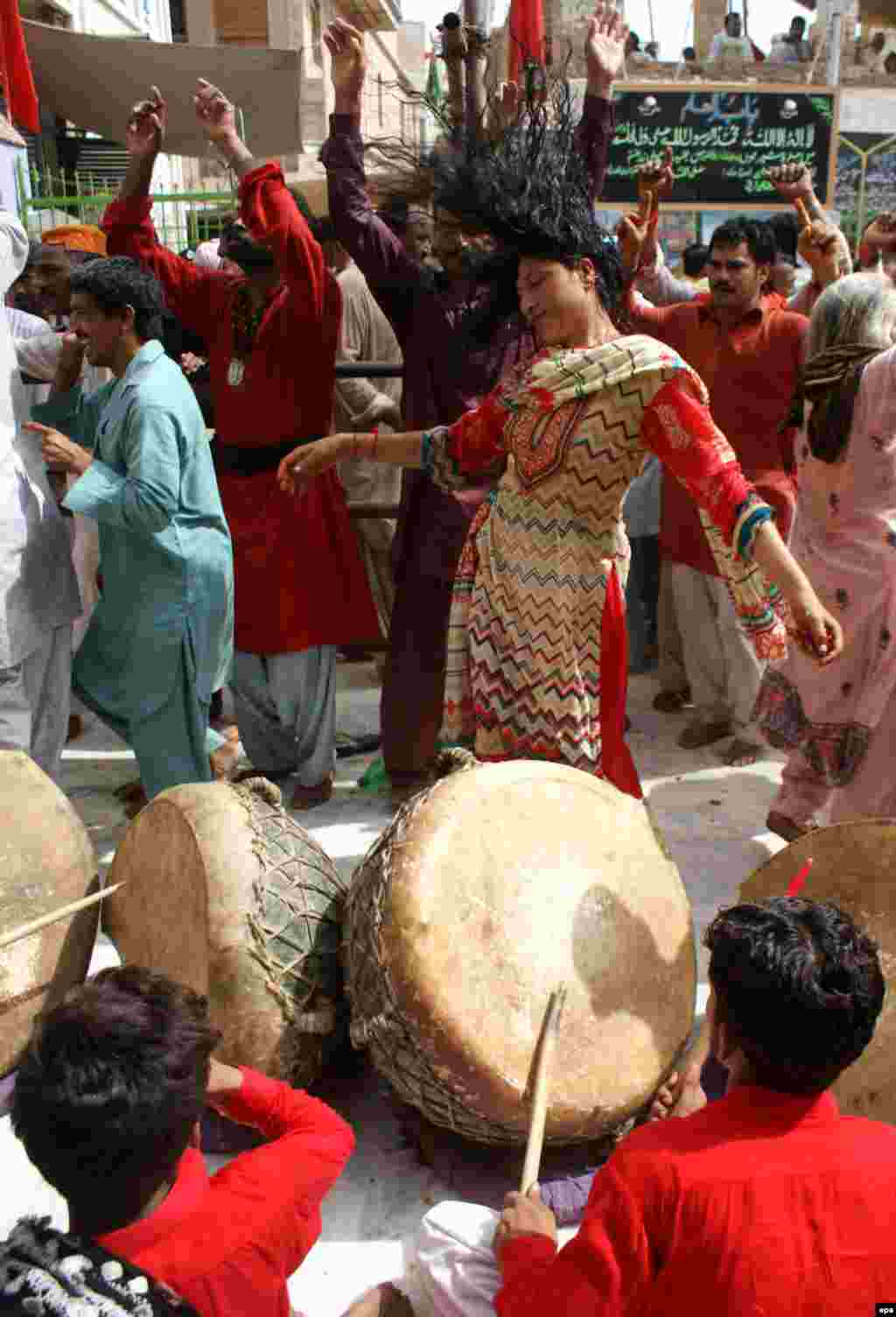 A Sufi woman dances during the annual celebrations at the shrine in 2012. The devotees describe themselves as the &quot;Anti-Taliban&quot; and stand for &quot;love, tolerance and the great infinity.&quot; &nbsp;