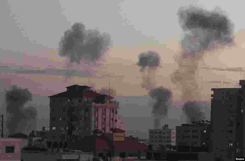 Smoke rises following Israeli air strikes in Gaza City on November 14.