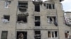 Ukraine -- Members of the Ukrainian armed forces stay at a building damaged in fighting with pro-Russian separatists in Pisky village, near Donetsk,July 6, 2015