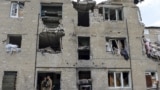 Ukraine -- Members of the Ukrainian armed forces stay at a building damaged in fighting with pro-Russian separatists in Pisky village, near Donetsk,July 6, 2015