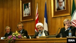 Iranian President Hassan Rohani has previously served as Iran’s top nuclear negotiator (second from right), here with British Foreign Secretary Jack Straw (left), French Foreign Minister Dominique de Villepin (second left), and German Foreign Minister Joschka Fischer (right) during nuclear talks in 2003. 