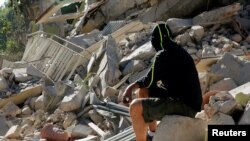 A collapsed building following the earthquake in Amatrice, central Italy.