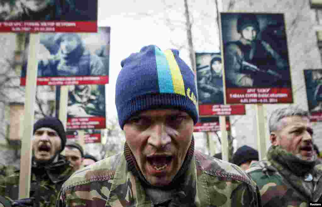 Activists from the Right Sector political party attend an antigovernment march in Kyiv on February 25. (Reuters/Valentyn Ogirenko)