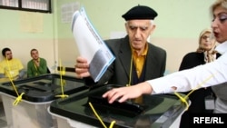 A man casts his vote at a polling station in Kosovo's capital, Pristina, on November 15.