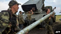 Ukrainian soldiers charge a Grad multiple rocket launcher system near the eastern city of Shchastya in August 2014.