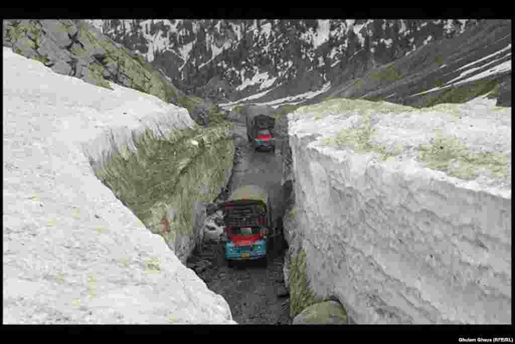 Trucks navigate a mountain road as snow and rain wreak havoc in Pakistan&#39;s northern Kyber Pakhtunkhwa and FATA regions.