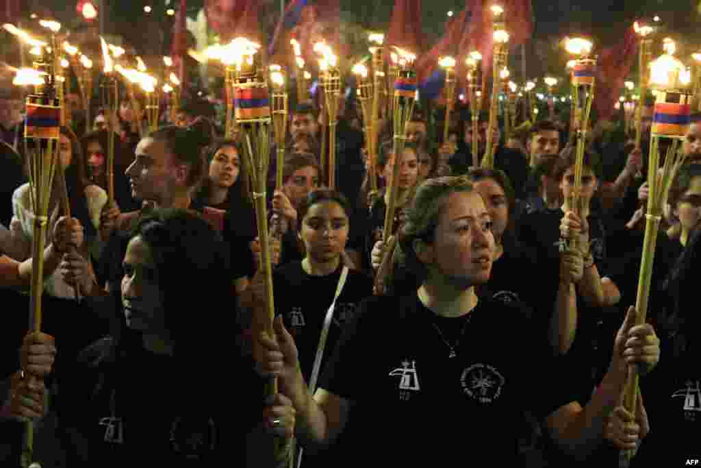 People in Yerevan take part in a torchlight procession to mark the anniversary of mass killings of ethnic Armenians in Ottoman-era Turkey on April 24. (AFP/Karen Minasyan)