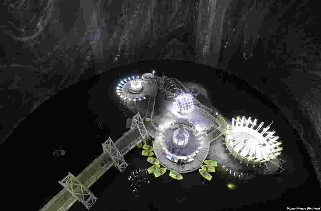 A general view of a chamber with an underground lake and boats inside the Salina Turda salt mine in Romania. (Reuters/Stoyan Nenov)