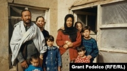 Kabir with his family outside their home in the Kart-i-Sei district of western Kabul