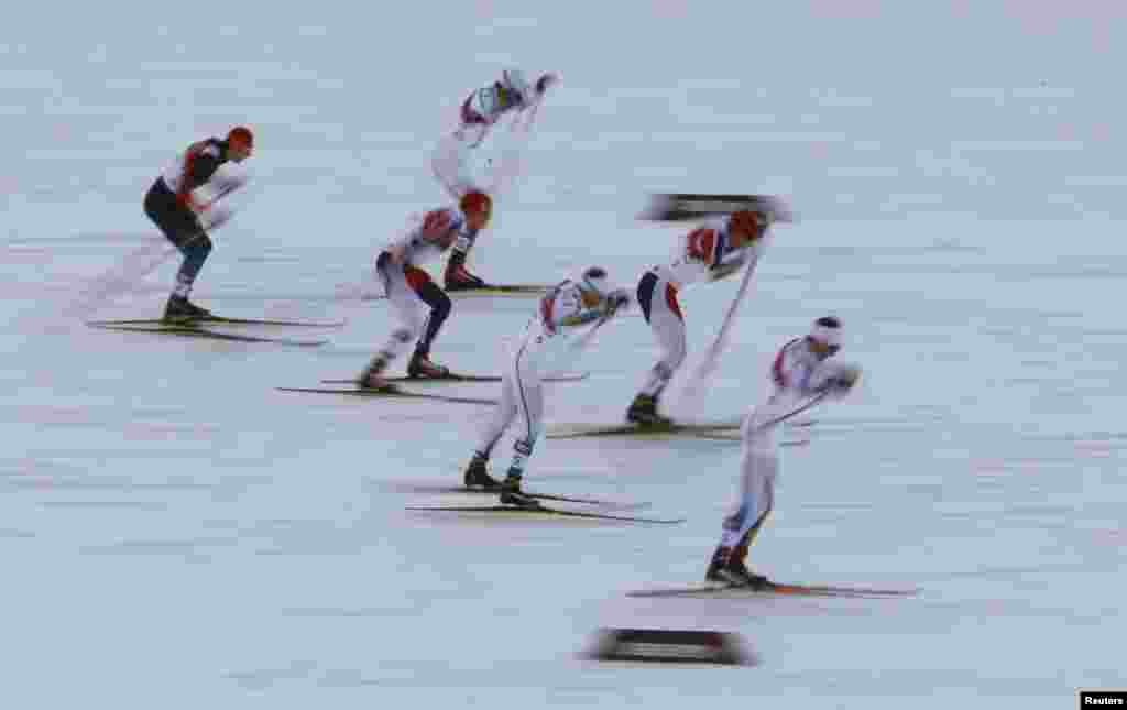 Norway's Ola Vigen Hattestad (2nd right) and Sweden's Teodor Peterson (right) and Emil Joensson (3rd right) compete in the men's cross-country sprint final.