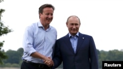 U.K. Prime Minister David Cameron with Russian President Vladimir Putin (file photo)