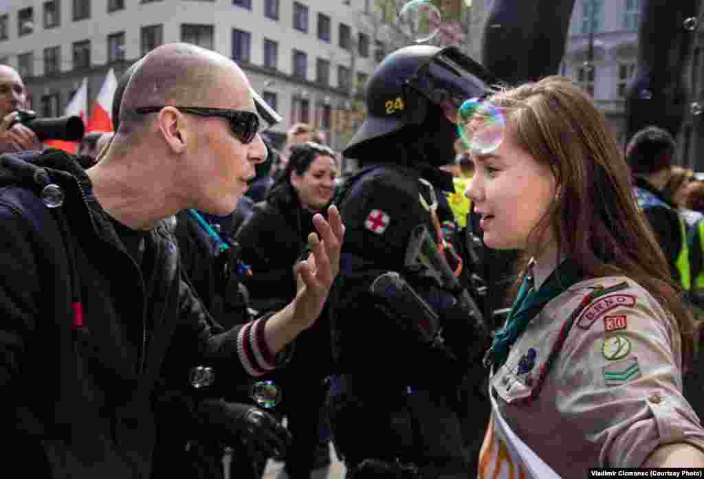 A 16-year-old Czech girl scout stands up to a neo-Nazi demonstrator during a May Day rally in Brno, Czech Republic, on May 1. (Vladimir Cicmanec)
