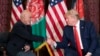 U.S. President Donald Trump meets with Afghan President Ashraf Ghani during a surprise visit to the country, at Bagram Air Field, in November 2019. Trump is pushing to withdraw more troops before the November vote in order to meet a campaign pledge.