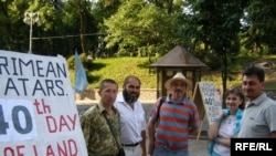 Crimean Tatars continue to protest in front of the government building in Kyiv, demanding the return of land seized during World War II.