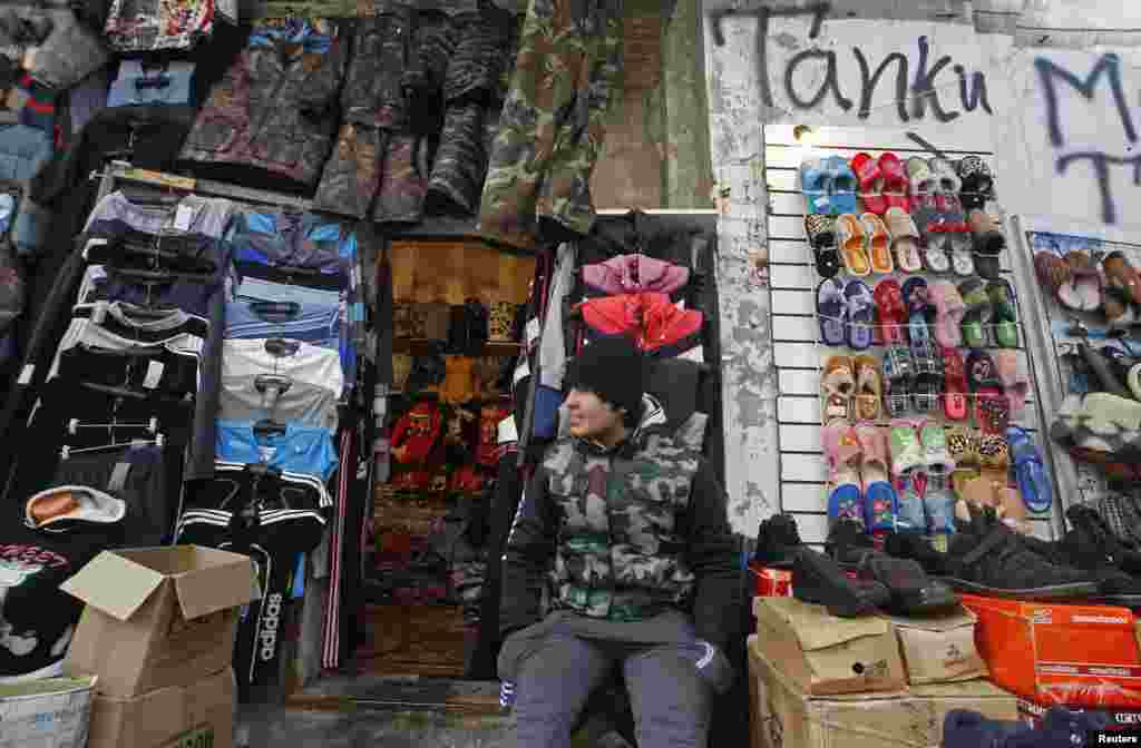 A trader waits for business at a shop in Apraksin Dvor, a market that has existed since the 18th century in central St. Petersburg. (Reuters/Alexander Demianchuk)