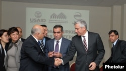 Armenian and Turkish entrepreneurs greet each other at the cross-border business forum in Yerevan.