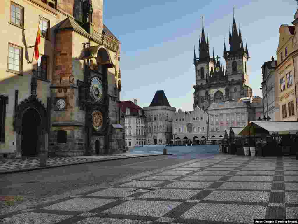 One of Prague&#39;s most famous sites, Old Town Square, stands nearly empty. This space is usually thronged with thousands of tourists.&nbsp;