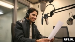 Asadullah Lodin, an Afghan student and aspiring journalist, practices his on-air skills during a media training at RFE/RL's Prague headquarters.