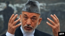 Afghan President Hamid Karzai speaks during a press conference at the Presidential Palace in Kabul on June 12.