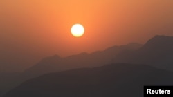The mountainous Afghanistan-Pakistan border at sunset as seen from Afghanistan's Kunar Province (file photo)