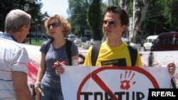 Rights activists march against police brutality in Moldova.