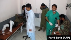 Wounded Afghan National Army soldiers receive treatment in a hospital after a suicide bomber blew himself up inside a packed mosque on a base in Khost Province on November 23.