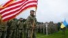 U.S. and Ukrainian soldiers attend the opening ceremony of a military exercise in Ukraine's western Lviv region in September 2021.