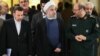 Iranian President Hassan Rohani (center) along with Defense Minister Hossein Dehghan (right) and Chief of Staff Mahmud Vaezi