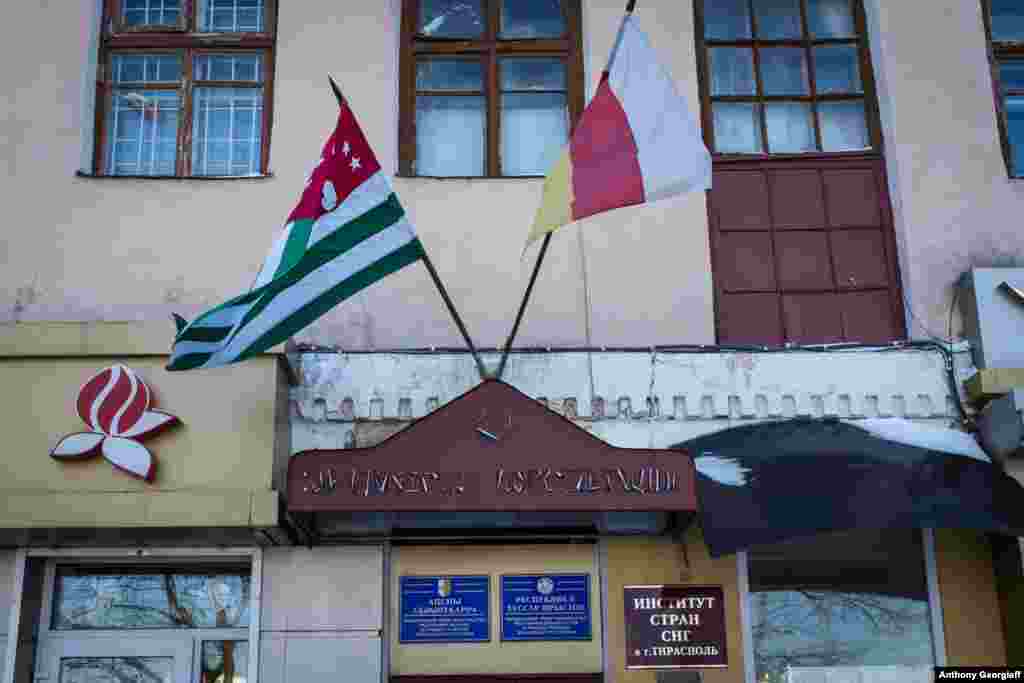 The flags of Georgia&#39;s breakaway regions of Abkhazia and South Ossetia fly in front of an office in Tiraspol. Those regions, along with Nagorno-Karabakh, are the only territories that recognize the independence of Transdniester.