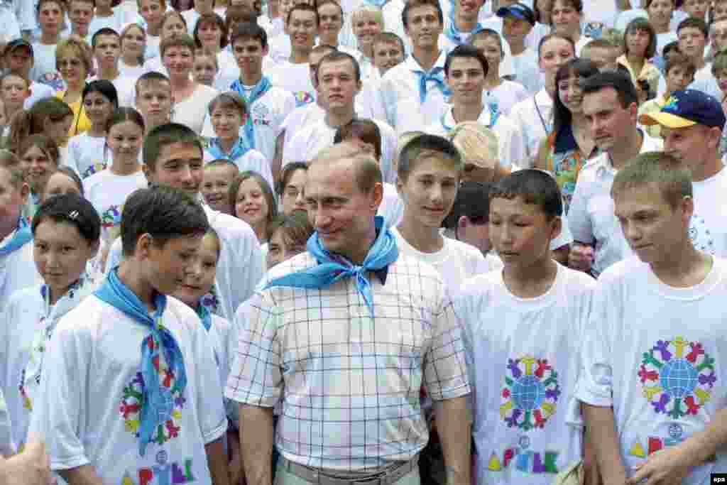 Putin visiting with campers -- now wearing blue scarves instead of communist-era red -- at Artek in 2001. After the collapse of the Soviet Union, the camp was changed from a Young Pioneer site to an "international children's center."