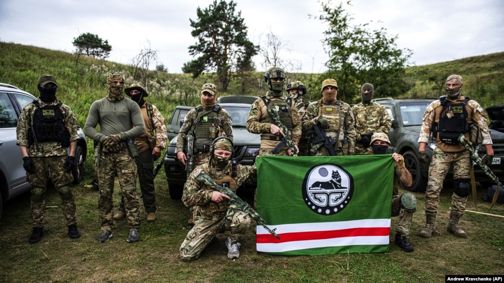 Fighters from the Dzhokhar Dudayev battalion, which fights for Ukraine in the war against Russia, pose during training near Kyiv on August 27.
