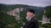 Maxime stands by the railing atop the Katskhi Pillar enjoying the beautiful view on June 18, 2013.
