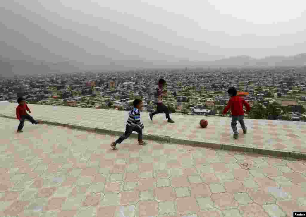 Afghan boys play soccer on a hilltop overlooking Kabul. (AFP/Mohammad Ismail)