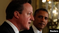 British Prime Minister David Cameron (left) speaks during a joint press conference with U.S. President Barack Obama in Washington on May 13.