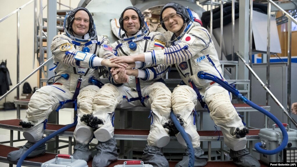 Two Us Astronauts One Russian Cosmonaut Arrive At Space - 