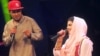 Afghan singer Zulala Hashemi (r) performs alongside competitor Sayed Jamal Mubarez (l) during the television music competition Afghan Star.