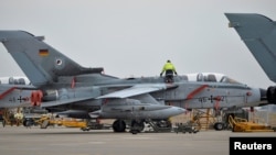 A technician works on a German Tornado jet at the air base in Incirlik.