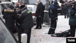 Stanislav Markelov and a journalist were shot by a single gunman on a Moscow street.