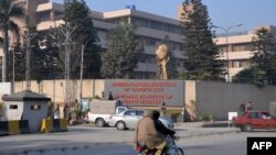 Security personnel keep watch outside the Armed Forces Institute of Cardiology in Rawalpindi, Pakistan, after a small fire broke out there on January 15. 