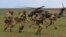 British soldiers disembark from a US military helicopter during the Wind Spring 15 NATO military exercises in Romania on April 21.