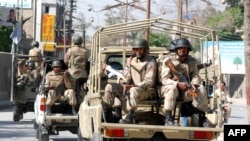 Pakistani paramilitary troopers patrol a street in Quetta, Pakistan.