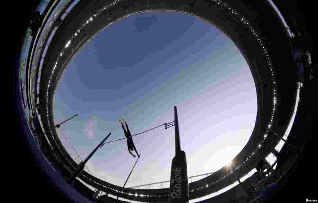 A fisheye view of&nbsp;Ashton Eaton of the United States clearing the bar in the men&#39;s decathlon pole vault final.&nbsp;