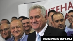 Serbian President-elect Tomislav Nikolic (foreground) celebrates his election victory with supporters in Belgrade.